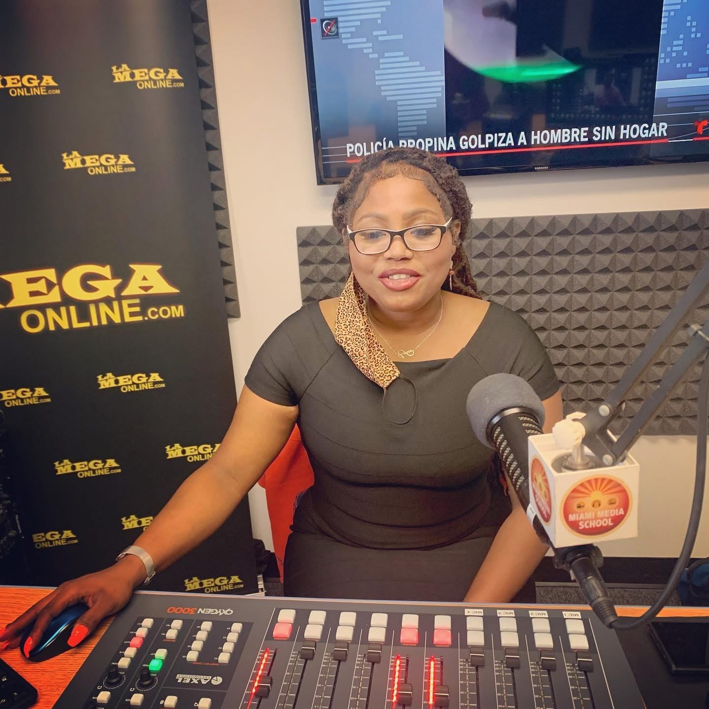 Dr. Loriane Clarke on-air as a radio broadcaster